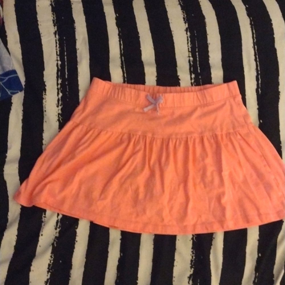 A children's salmon pink skirt